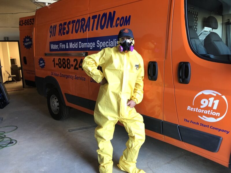 911 Restoration technician in Hazmat suit